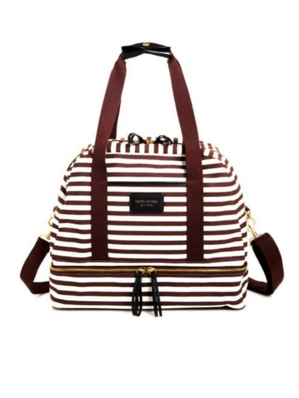 This Henri Bendel travel bag features a classic white and brown striped design